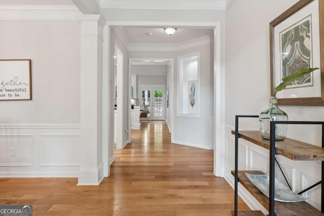 550 Mae Ln, Alpharetta, GA 30004 - hall featuring a decorative wall, light wood-style flooring, french doors, crown molding, and ornate columns