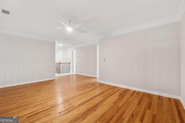 550 Mae Ln, Alpharetta, GA 30004 - empty room with crown molding, a ceiling fan, attic access, light wood-type flooring, and baseboards