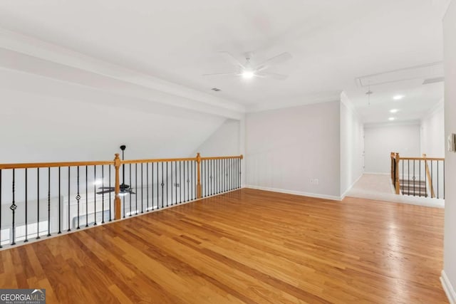 550 Mae Ln, Alpharetta, GA 30004 - unfurnished room with attic access, light wood-style flooring, a ceiling fan, ornamental molding, and baseboards