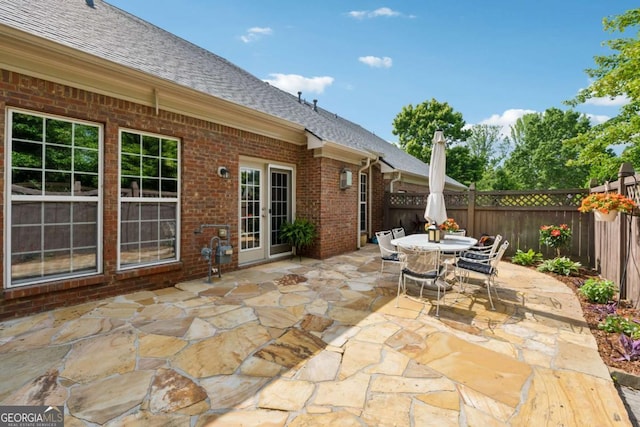 550 Mae Ln, Alpharetta, GA 30004 - fenced backyard featuring a patio area, outdoor dining space, and french doors