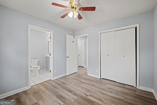 202 E 5th Ave, Winder, GA 30680 - unfurnished bedroom featuring wood finished floors, a closet, and baseboards