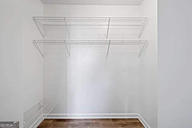 202 E 5th Ave, Winder, GA 30680 - spacious closet featuring dark wood-style floors