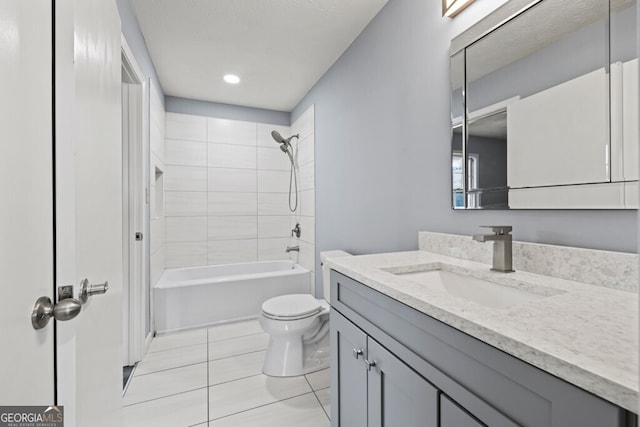 202 E 5th Ave, Winder, GA 30680 - bathroom with tile patterned floors, toilet, vanity, and bathtub / shower combination