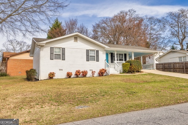 202 E 5th Ave, Winder, GA 30680 - ranch-style house with concrete driveway, brick siding, covered porch, an attached carport, and crawl space