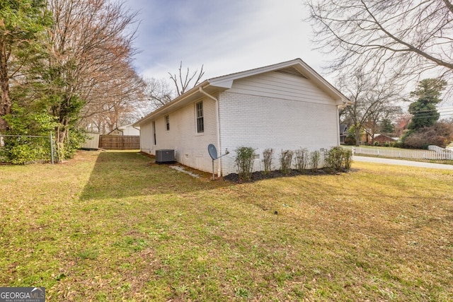 202 E 5th Ave, Winder, GA 30680 - view of side of home featuring cooling unit and brick siding