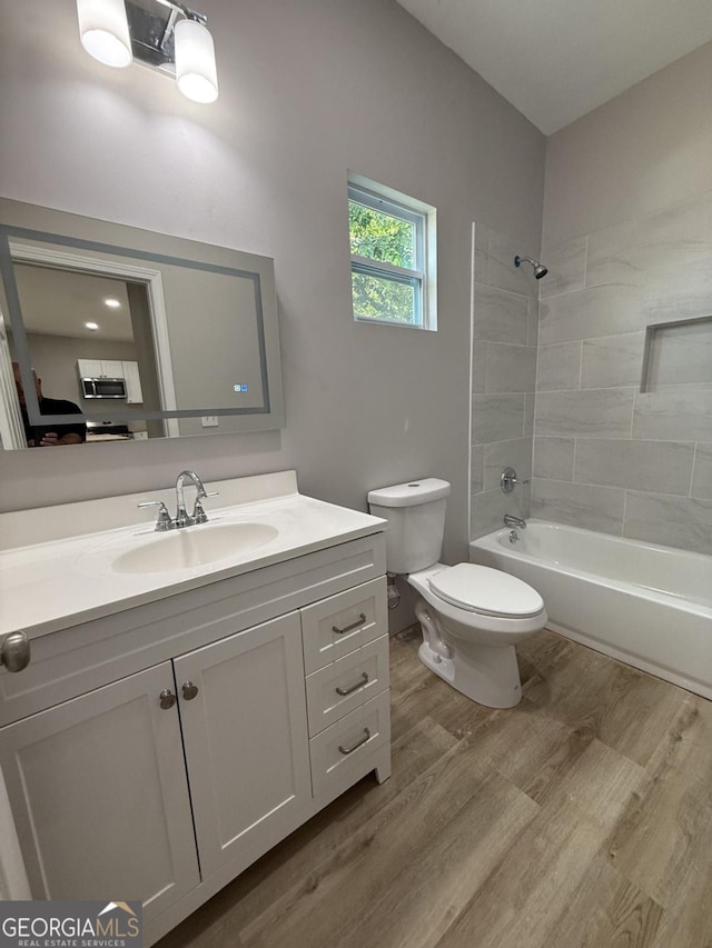 1300 Murphy Ave, Lagrange, GA 30240 - full bathroom featuring toilet, vanity, wood finished floors, and  shower combination