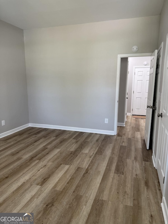 1300 Murphy Ave, Lagrange, GA 30240 - spare room featuring dark wood-style flooring, baseboards, and a smoke detector