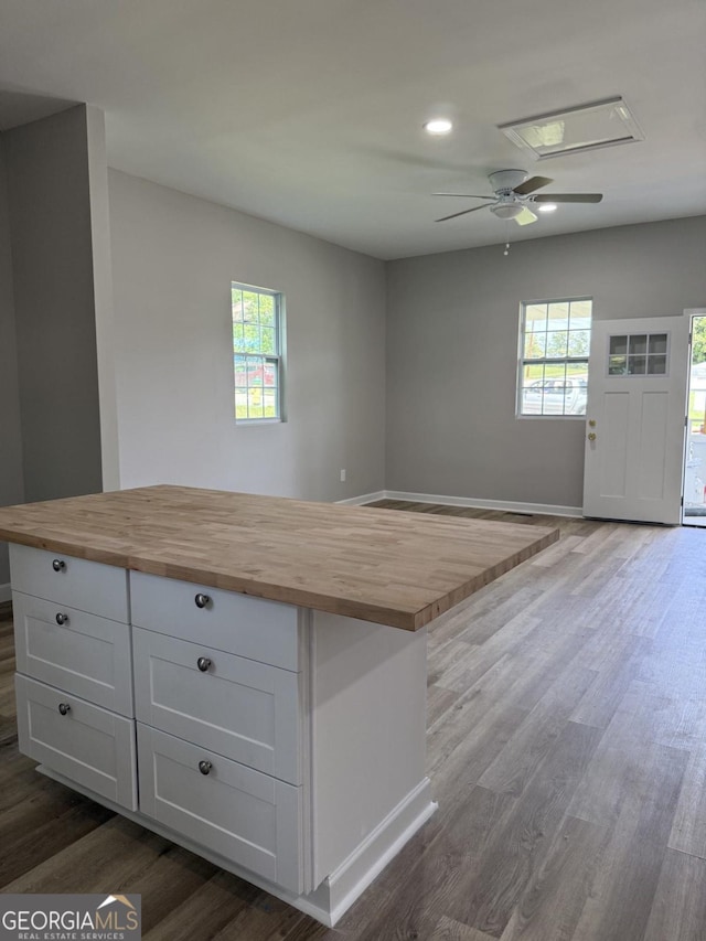 1300 Murphy Ave, Lagrange, GA 30240 - kitchen with butcher block counters, dark wood finished floors, white cabinets, healthy amount of natural light, and recessed lighting