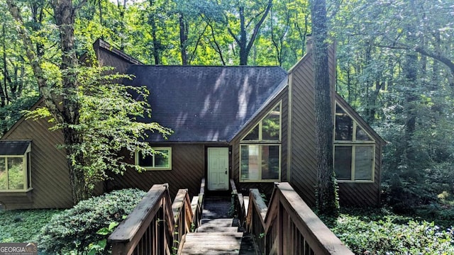 3246 Able Ct, Marietta, GA 30062 - view of front of house featuring a chimney and a forest view