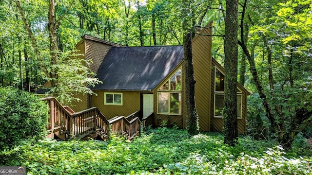 3246 Able Ct, Marietta, GA 30062 - rear view of property featuring a chimney, a deck, a shingled roof, and a view of trees