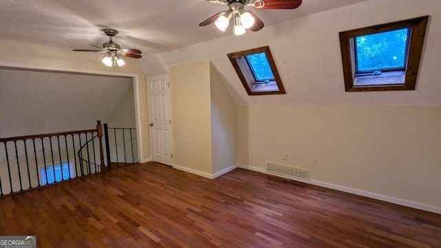 3246 Able Ct, Marietta, GA 30062 - additional living space with a skylight, ceiling fan, wood finished floors, and lofted ceiling
