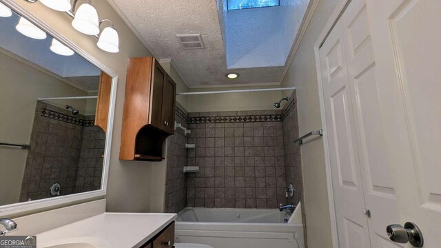3246 Able Ct, Marietta, GA 30062 - bathroom with vanity, shower / bath combination, and a textured ceiling