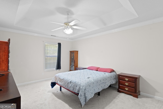 3005 Ryan Rd, Locust Grove, GA 30248 - carpeted bedroom with ornamental molding, a tray ceiling, baseboards, and a ceiling fan