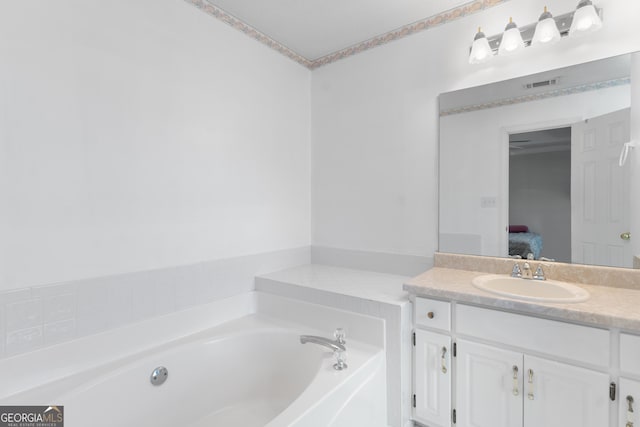 3005 Ryan Rd, Locust Grove, GA 30248 - ensuite bathroom with a bath and vanity