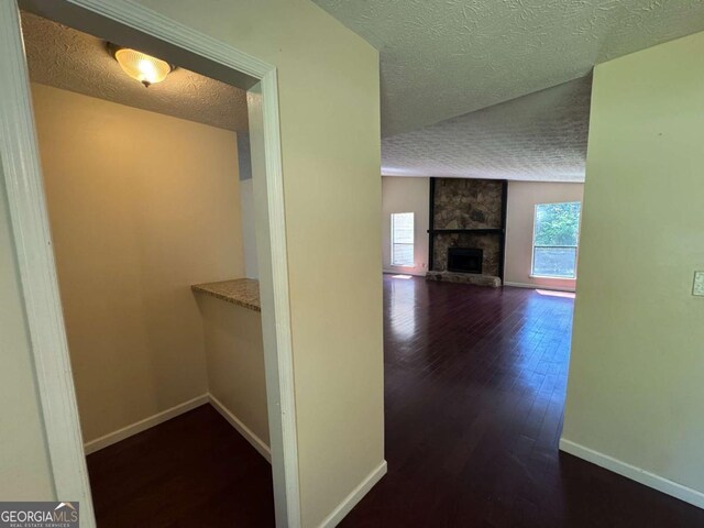 120 Squirrel Way, Atlanta, GA 30349 - hallway with a textured ceiling and wood finished floors
