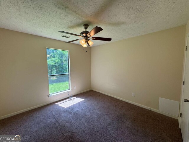 120 Squirrel Way, Atlanta, GA 30349 - spare room featuring a ceiling fan, carpet flooring, and a textured ceiling