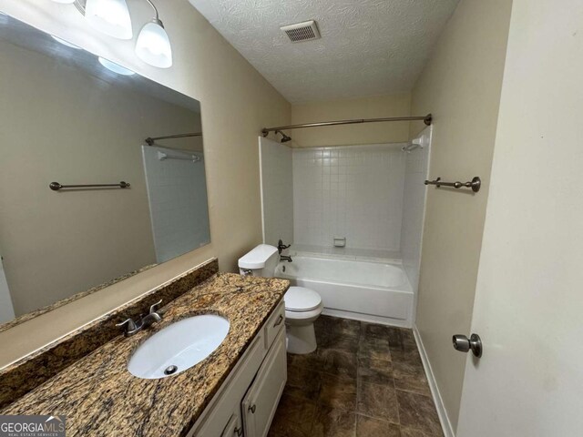 120 Squirrel Way, Atlanta, GA 30349 - full bath featuring vanity, a textured ceiling, and shower / washtub combination