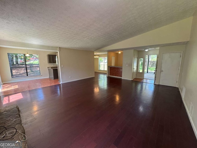 120 Squirrel Way, Atlanta, GA 30349 - unfurnished living room featuring a textured ceiling and wood finished floors