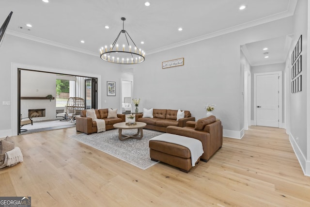 245 Mitchell Rd, Monroe, GA 30656 - living room with light wood-style floors, crown molding, recessed lighting, baseboards, and a fireplace with raised hearth