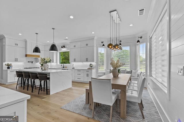 245 Mitchell Rd, Monroe, GA 30656 - dining room featuring healthy amount of natural light, recessed lighting, a chandelier, and light wood-type flooring