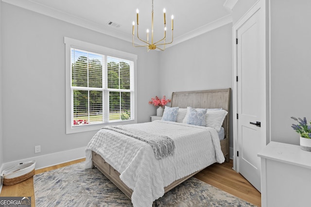 245 Mitchell Rd, Monroe, GA 30656 - bedroom featuring a chandelier, ornamental molding, wood finished floors, and baseboards