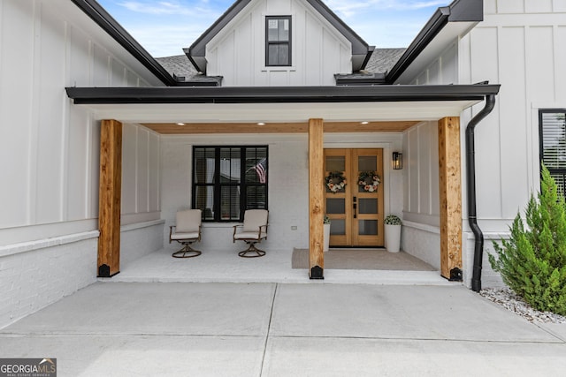 245 Mitchell Rd, Monroe, GA 30656 - entrance to property with board and batten siding, covered porch, and a shingled roof