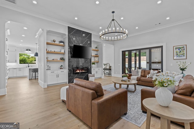 245 Mitchell Rd, Monroe, GA 30656 - living area with recessed lighting, ornamental molding, healthy amount of natural light, a high end fireplace, and light wood-type flooring
