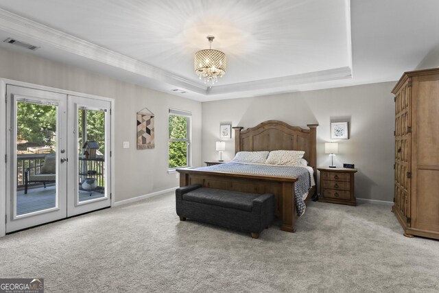 237 Parc Dr, Canton, GA 30114 - bedroom featuring access to outside, light colored carpet, a chandelier, a raised ceiling, and french doors
