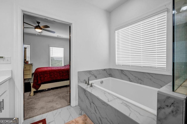 4565 Sims Park Overlook, Suwanee, GA 30024 - bathroom featuring marble look tile flooring, a bath, a ceiling fan, vanity, and ensuite bathroom