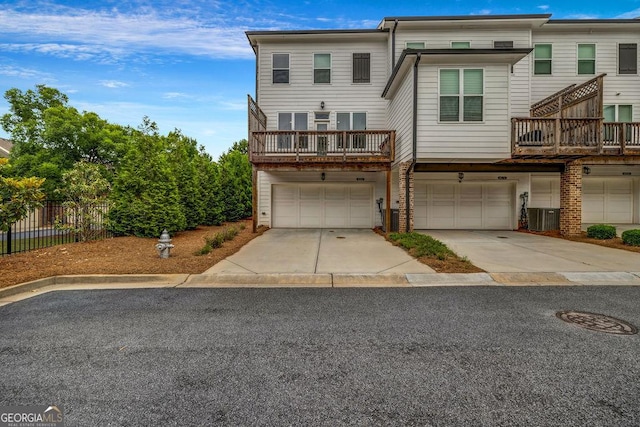 4565 Sims Park Overlook, Suwanee, GA 30024 - view of property featuring a garage, central AC, and concrete driveway