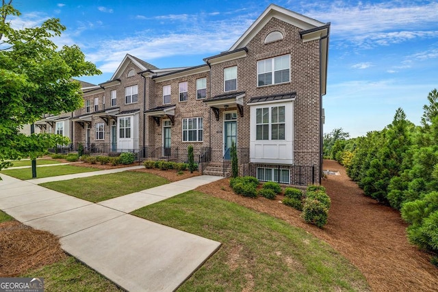 4565 Sims Park Overlook, Suwanee, GA 30024 - view of property with brick siding and a front yard
