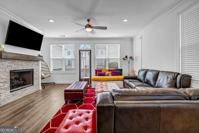 4565 Sims Park Overlook, Suwanee, GA 30024 - living area featuring a ceiling fan, crown molding, wood finished floors, a fireplace, and recessed lighting