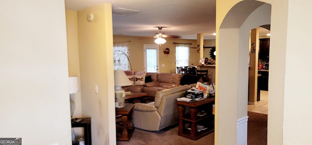111 Tyndall St, Perry, GA 31069 - living room with ceiling fan, carpet flooring, and arched walkways