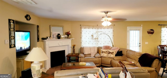 111 Tyndall St, Perry, GA 31069 - living area with a ceiling fan and a fireplace