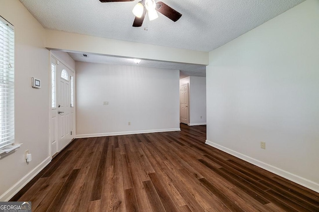 1282 Long Bridge Rd, Rincon, GA 31326 - spare room featuring dark wood-style floors, a ceiling fan, baseboards, and a textured ceiling