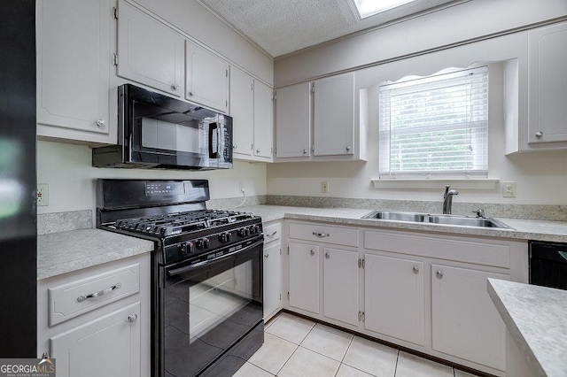 1282 Long Bridge Rd, Rincon, GA 31326 - kitchen featuring black appliances, a sink, light countertops, light tile patterned floors, and a textured ceiling