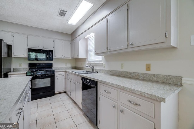 1282 Long Bridge Rd, Rincon, GA 31326 - kitchen featuring black appliances, a sink, light countertops, and light tile patterned floors