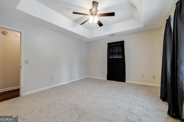 1282 Long Bridge Rd, Rincon, GA 31326 - carpeted spare room with a raised ceiling, ceiling fan, baseboards, a textured ceiling, and a smoke detector