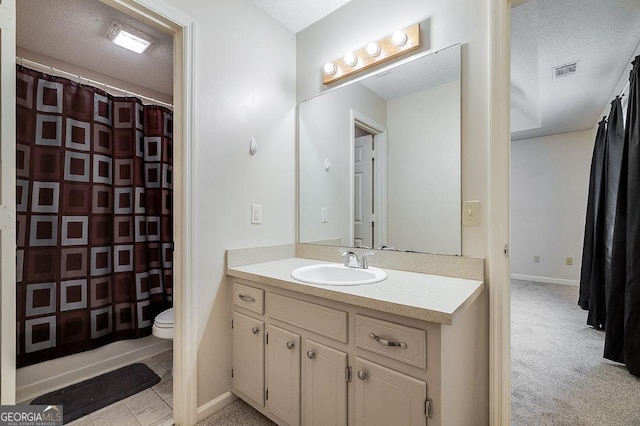 1282 Long Bridge Rd, Rincon, GA 31326 - bathroom featuring a textured ceiling, vanity, toilet, and a shower with shower curtain