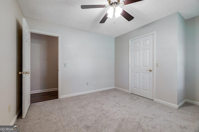 1282 Long Bridge Rd, Rincon, GA 31326 - unfurnished bedroom featuring carpet, a textured ceiling, baseboards, and ceiling fan