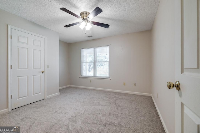 1282 Long Bridge Rd, Rincon, GA 31326 - empty room featuring carpet, a textured ceiling, baseboards, and a ceiling fan