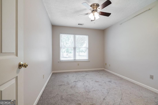 1282 Long Bridge Rd, Rincon, GA 31326 - spare room with a textured ceiling, carpet floors, ceiling fan, and baseboards