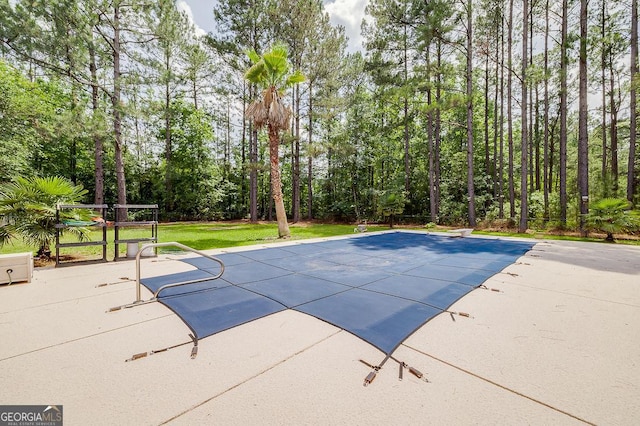 1282 Long Bridge Rd, Rincon, GA 31326 - view of swimming pool with a diving board, a patio, a covered pool, and a lawn