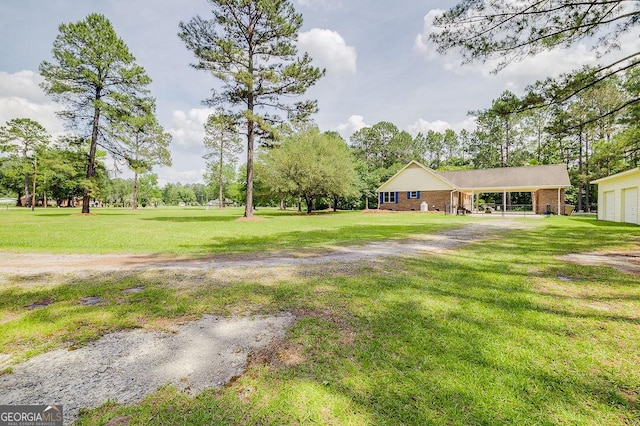 1282 Long Bridge Rd, Rincon, GA 31326 - view of grassy yard featuring a garage