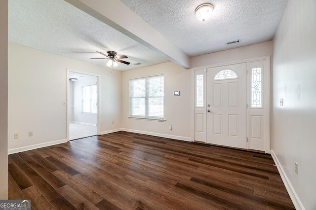 1282 Long Bridge Rd, Rincon, GA 31326 - foyer entrance with a textured ceiling, dark wood finished floors, ceiling fan, and baseboards