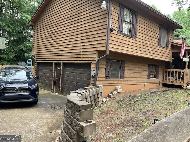 170 Beatrice St, Dallas, GA 30157 - view of home's exterior featuring a garage and concrete driveway
