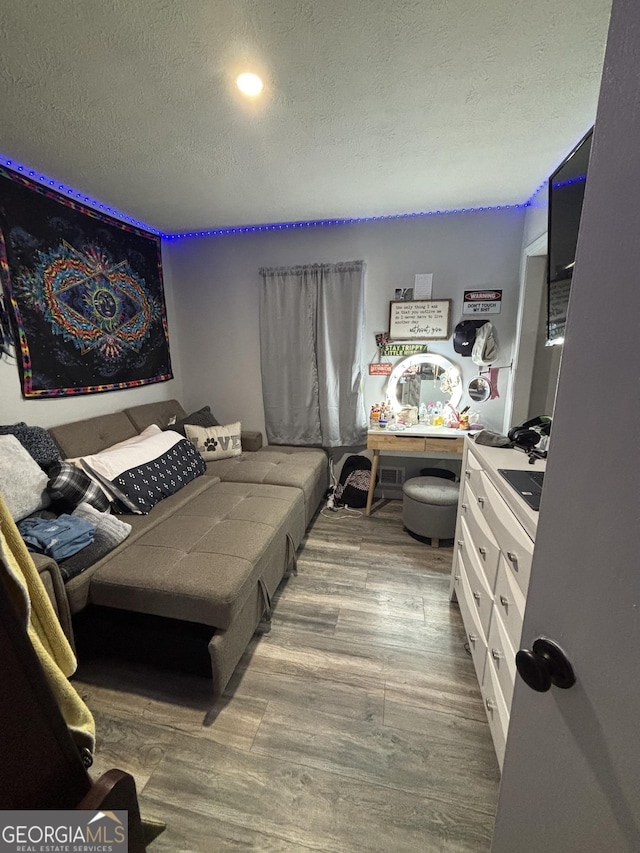 170 Beatrice St, Dallas, GA 30157 - bedroom with wood finished floors and a textured ceiling