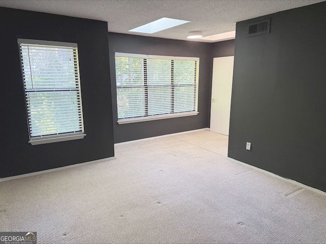 1818 Huntingdon Chase, Atlanta, GA 30350 - bedroom with a skylight, light carpet, and a textured ceiling