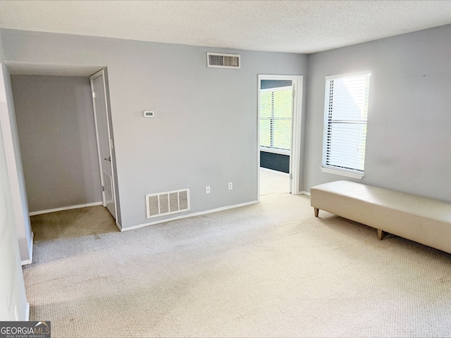 1818 Huntingdon Chase, Atlanta, GA 30350 - empty room with carpet flooring, baseboards, and a textured ceiling