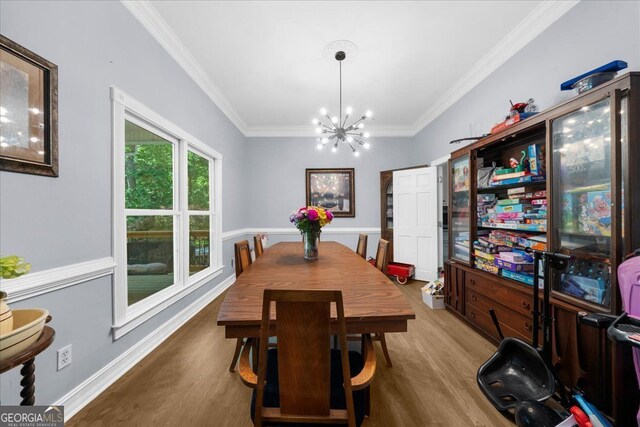 9035 Walnut Cove Ct, Gainesville, GA 30506 - dining area featuring wood finished floors, crown molding, a chandelier, and baseboards